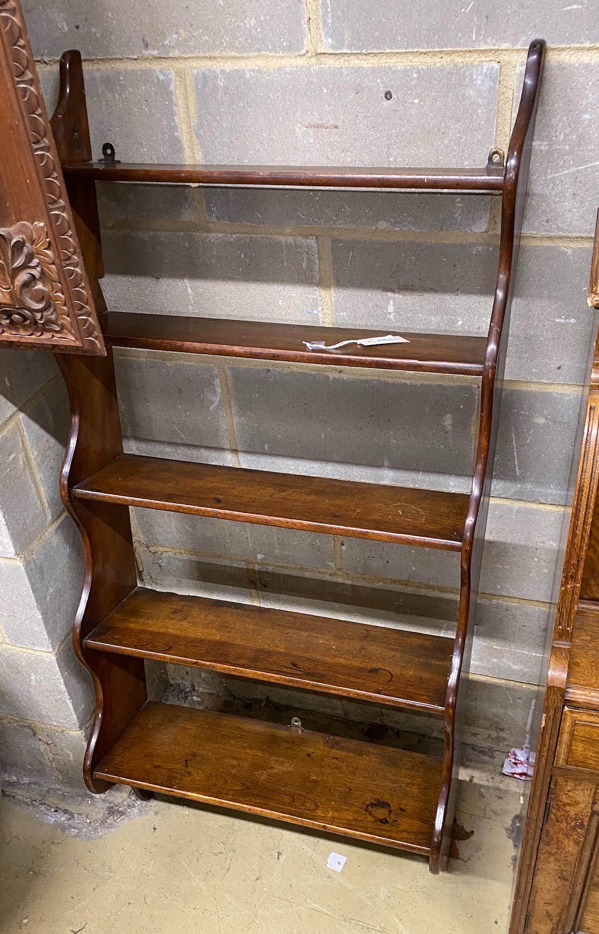 A Victorian mahogany five tier wall bracket, width 66cm, height 148cm together with a reproduction yew wall bracket